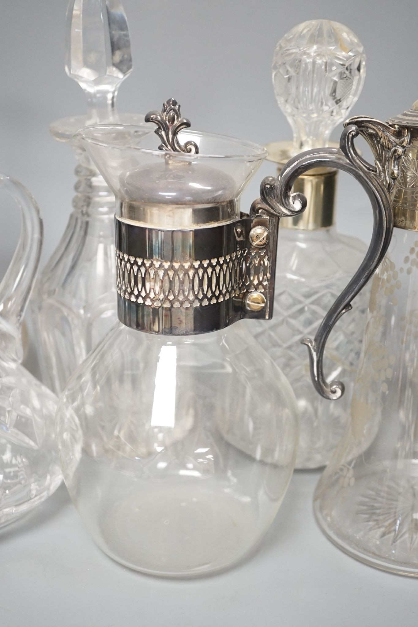 A Hukin and Heath claret jug and other decanters etc.